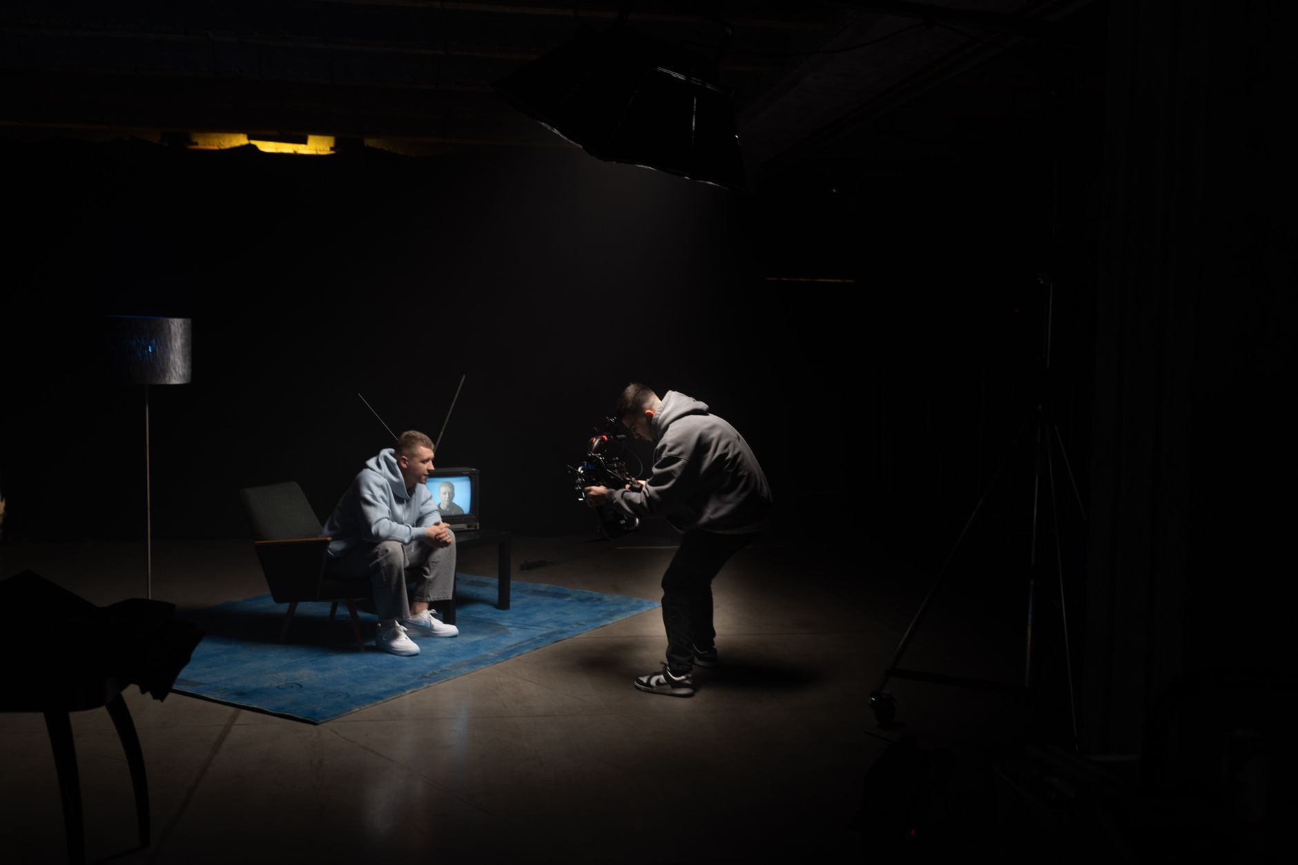 Camera filming actor on set
